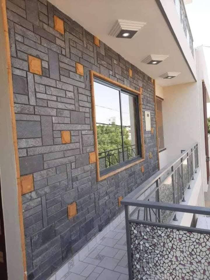 Beige stone wall column