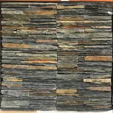Dark stacked stone facade with plants